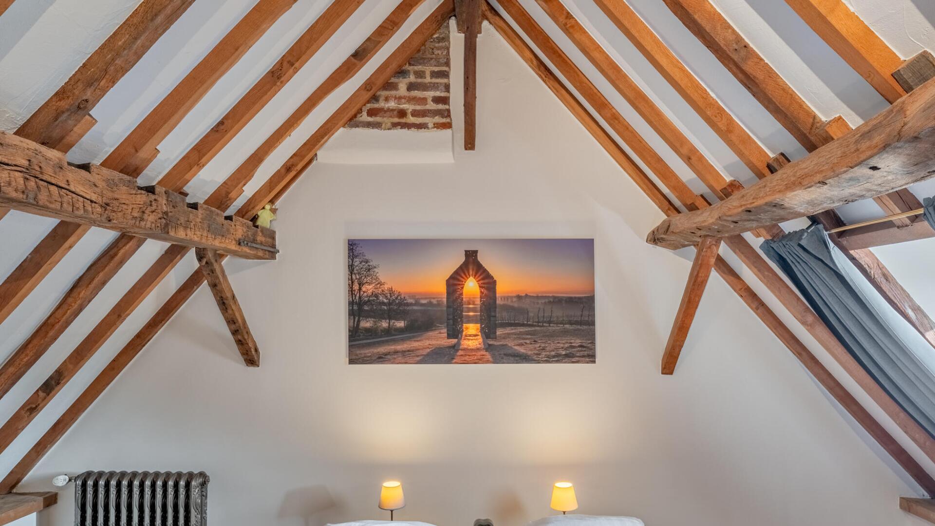Vakantiewoning Begijnhof 54 - Gastenkamer 1: logeren onder het authentieke dakgebinte.