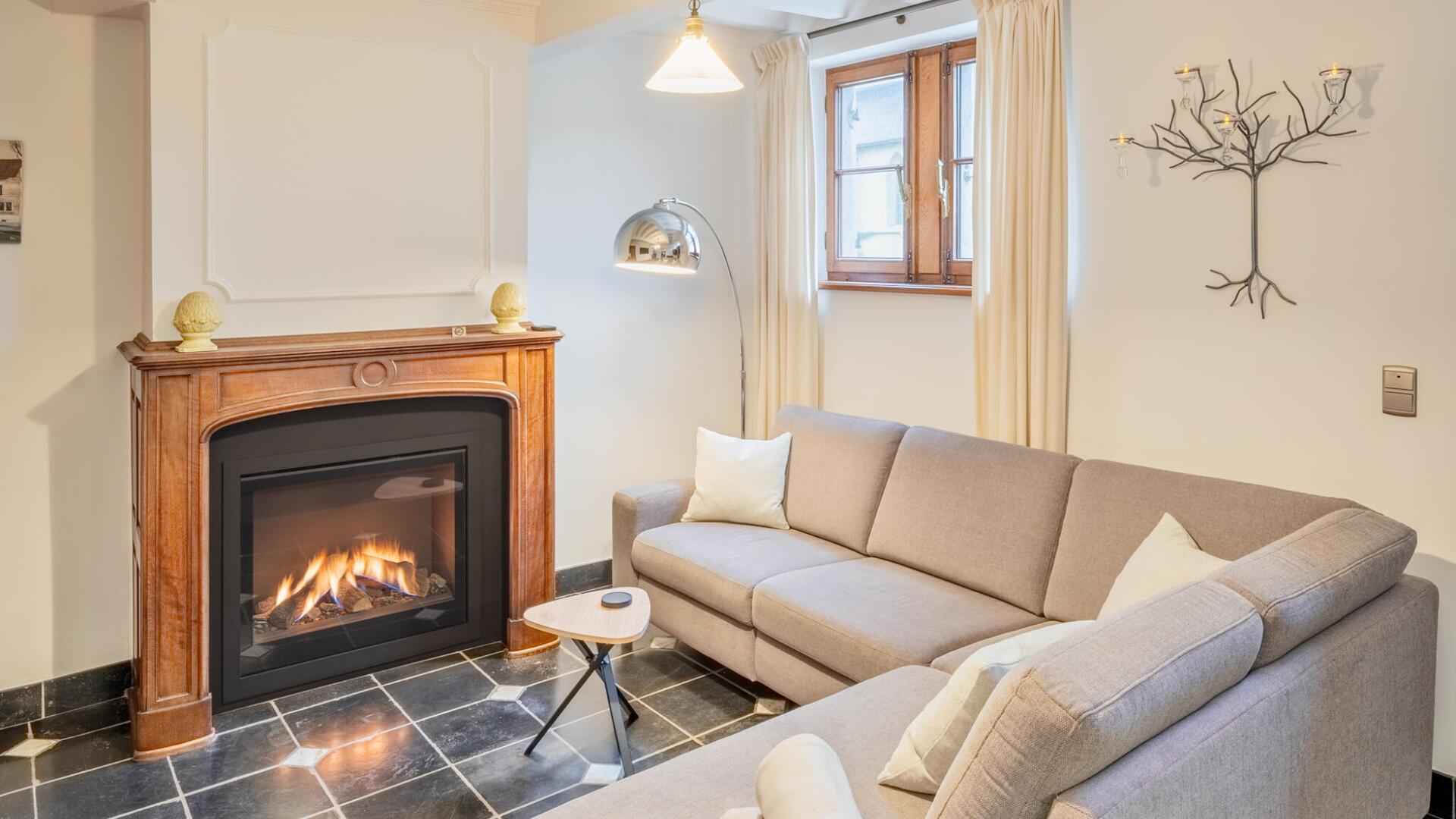 Vakantiewoning Begijnhof 54 - Knusse zithoek met haardvuur